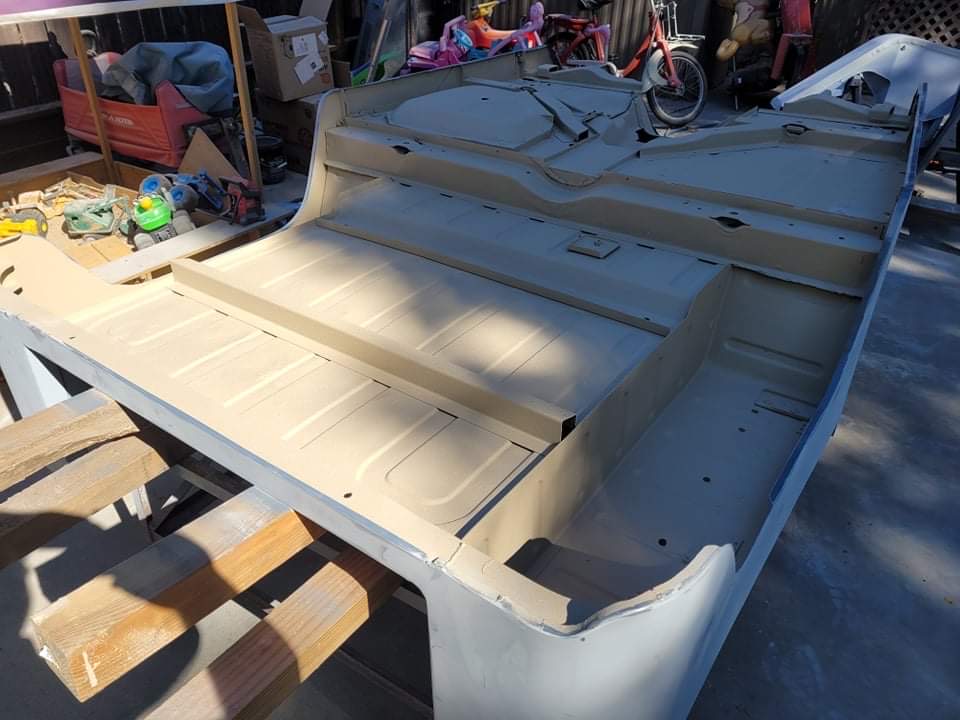 Painted body panels — strong, repairable, period-correct color
