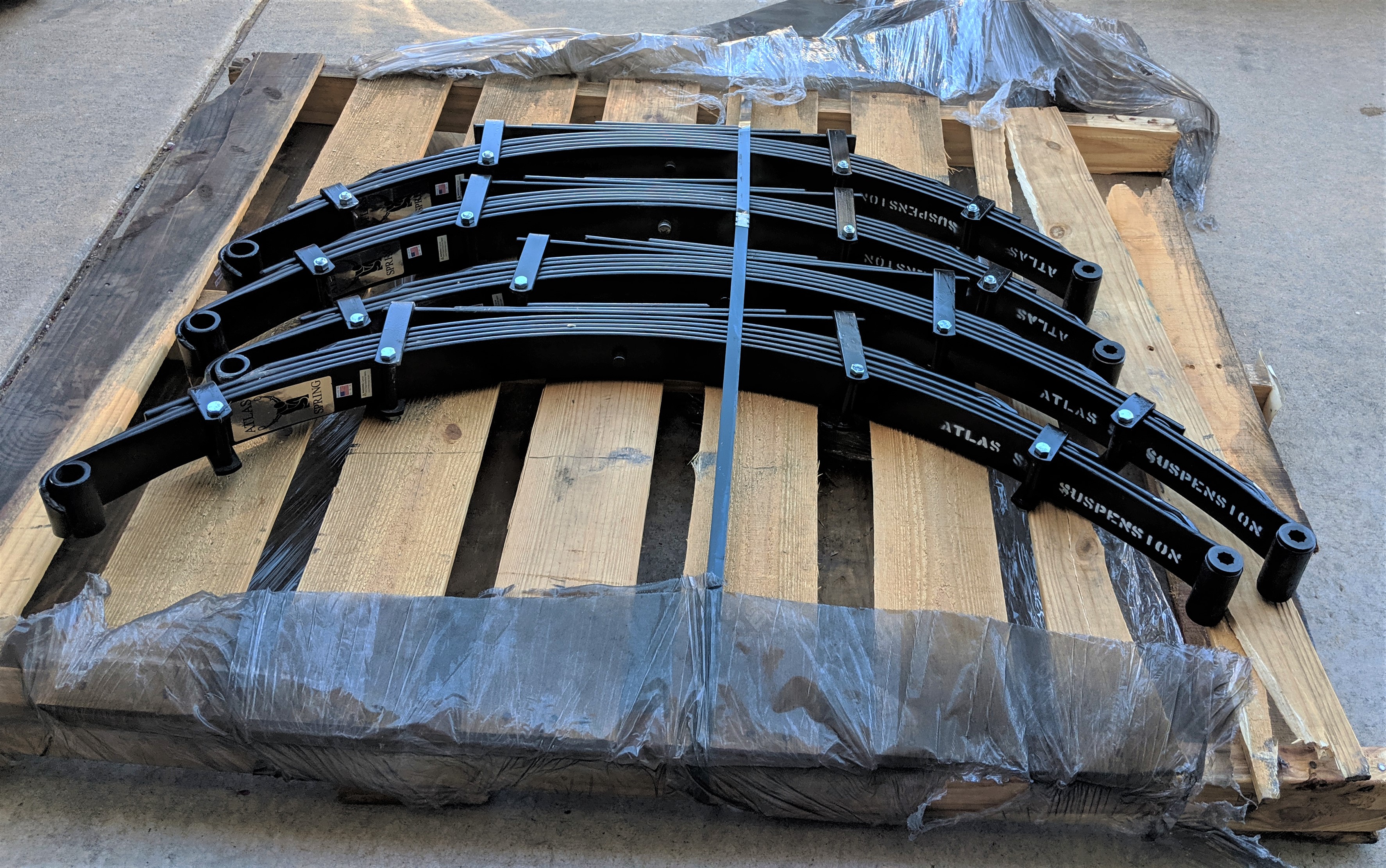 Custom suspension work — extended shock towers and shackle relocation